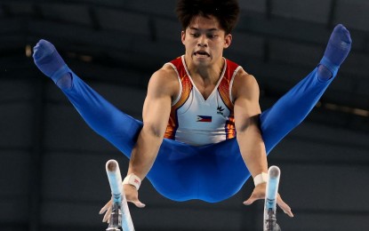 <p><strong>WINNING FORM.</strong> Two-time world champion Carlos Yulo shows his winning form to win the parallel bars gold medal in the 32nd Southeast Asian Games in Phnom Penh, Cambodia on May 9, 2023. President Ferdinand R. Marcos Jr. will lead the awarding of cash incentives to SEAG and ASEAN Para Games medalists on July 20, 2023 at the Malacañang Palace. <em>(Contributed photo)</em></p>