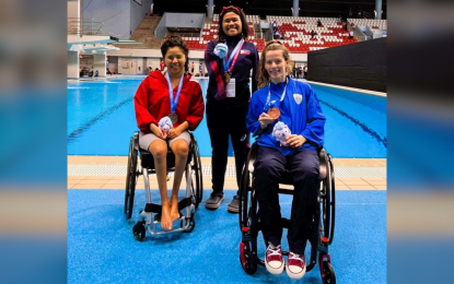 <p><strong>TOP THREE</strong>. Filipino gold medalist Angel Mae Otom (center) with silver medalist Xiu Pin Yip of Singapore (left) and bronze medalist Alexandra Stamatopoulou of Greece during the awarding ceremony of the women's 50m event of the Citi Para Swimming World Series held in Singapore from April 29 to May 1, 2023. The tournament served as a qualifier for the World Championships in Manchester, the United Kingdom in July. <em>(Contributed photo)</em></p>