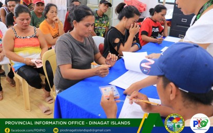 <p><strong>CASH FOR WORK.</strong> The Dinagat Islands provincial government provides cash-for-work opportunities to 60 poor residents from Barangay Cuarenta of San Jose town on Tuesday (May 9, 2023). The beneficiaries will render 10 days of work with a wage of PHP350 per day. <em>(Photo courtesy of Dinagat Islands PIO)</em></p>