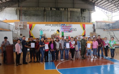 <p><strong>REBEL RETURNEES</strong>. Officials from the Department of Labor and Employment  and the Apayao provincial government lead the awarding of livelihood assistance to members of the disadvantaged sector as well as former members of the New People's Army on Tuesday (May 9, 2023). The awarding ceremony was held at the EKB Memorial Sports Gymnasium in Luna, Apayao.<em> (Photo courtesy of Jc Marquez-Apayao PIO)</em></p>