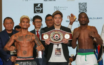 <p><strong>CHAMP.</strong> Filipino boxer John Riel Casimero (left) and Namibian Fillipus Nghitumbwa appear at the official weigh-in for their World Boxing Organization global super bantamweight fight at Okada Manila Hotel and Casino in Parañaque City on Friday (May 12, 2023). Casimero won by unanimous decision on Saturday (May 13). <em>(PNA photo by Yancy Lim)</em></p>