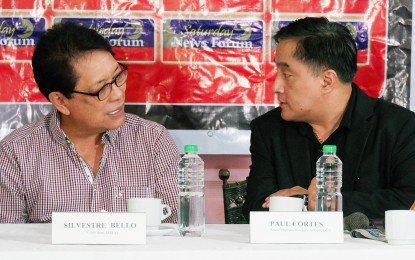 <p>Manila Economic and Cultural Office chief Silvestre Bello III (left) chats with Foreign Affairs Assistant Secretary for Migrant Workers Affairs Paul Cortes during the Saturday News Forum (May 13, 2023) in Quezon City. <em>(PNA photo by Robert Oswald Alfiler)</em></p>