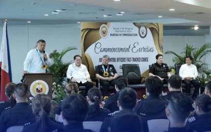 <p><strong>NEW IMMIGRATION OFFICERS</strong>. Justice Secretary Crispin Remulla (left) during the graduation ceremony of the 75 new immigration officers at the Ninoy Aquino International Airport Terminal 3 on Monday (May 15, 2023). Also in photo are (from left) Bureau of Immigration (BI) Deputy Commissioner Daniel Laogan, Commissioner Norman Tansingco, Deputy Commissioner Joel Anthony Viado and Undersecretary Jojo Cadiz. <em>(Photo courtesy of BI) </em></p>