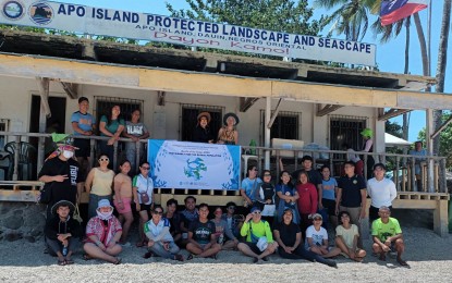 <p><strong>MONTH OF THE OCEAN.</strong> The Provincial Environment and Natural Resources Office in Negros Oriental province spearheads a multi-agency coastal clean-up and information campaign on Apo Island on Wednesday (May 17, 2023). The activity is in line with the celebration of the Month of the Ocean with the theme, "Sustainably Feed the Global Population." <em>(Photo courtesy of Jennifer Tilos/Philippine Information Agency)</em></p>
