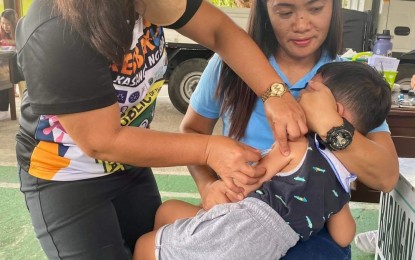 <p><strong>VACCINATION CAMPAIGN</strong>. A child in Ilocos Region receives measles-rubella vaccine in this undated photo as part of the immunization campaign of the Department of Health to prevent outbreaks. The DOH-Center for Health Development targets to immunize 104,281 children in the region within 2024. <em>(Photo courtesy of DOH-CHD-1)</em></p>