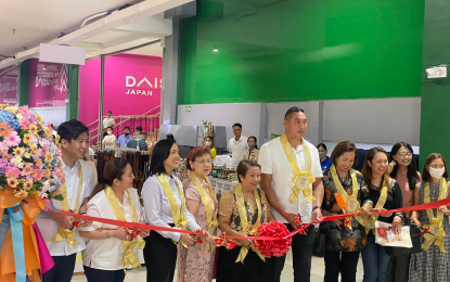 <p><strong>SPOTLIGHT ON SMALL BUSINESSES.</strong> San Juan Mayor Francis Zamora (center) and DTI-NCR director Marcelina Alcantara lead ribbon-cutting ceremonies marking the start of the Metro Fiesta de Mayo Trade Fair on May 18, 2023. The four-day event is being held at the Shoppesville Mall in Greenhills, San Juan City. <em>(Photo by Pot Chavez)</em></p>