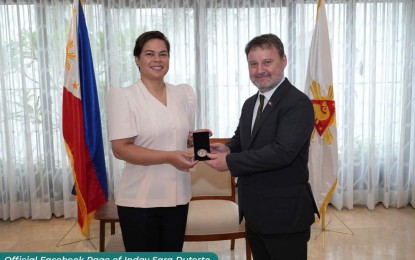 <p><strong>SUSTAINABLE FUTURE</strong>. Vice President and Education Secretary Sara Duterte (left) welcomes United Nations' Food and Agriculture Organization (FAO) representative to the Philippines Dr. Lionel Dabbadie in a courtesy call on Thursday (May 18, 2023). The two discussed the FAO’s "Forests for a Sustainable Future: Educating Children” project which seeks to educate learners about the vital link between a healthy forest cover and a steady food supply. <em>(Photo courtesy of Office of the Vice President)</em></p>