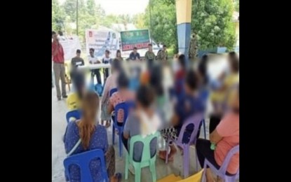 <p><strong>SEVERED TIES</strong>. Twenty supporters of the Communist Party of the Philippines - New People's Army (CPP-NPA) in Guimba, Nueva Ecija cut off their ties with the rebel group, during a ceremony held at a covered court in Barangay Manacsac on Thursday (May 18, 2023). They were members of the Liga ng Manggagawang Bukid and Alyansang Magbubukid sa Gitnang Luzon under the Kilusan ng Magbubukid ng Pilipinas. <em>(Photo courtesy of the Nueva Ecija Police Provincial Office)</em></p>
<p> </p>
<p> </p>