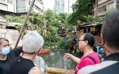 <p><strong>TRAGEDY.</strong> Three died, including a two-year-old, when a large tree fell on houses erected on a danger zone along the Estero de Magdalena creek in Binondo, Manila before dawn Thursday (May 18, 2023). The Bureau of Fire Protection has been ordered to investigate the collapse while the affected families are staying in a temporary shelter while waiting for their relocation. <em>(Courtesy of Manila-PIO)</em></p>