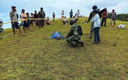 <p><strong>NPA ATROCITY.</strong> Police process the crime scene where a farmer was shot dead by New People's Army rebels in Guihulngan City, Negros Oriental on Saturday afternoon (May 20, 2023). The victim reportedly refused to continue to support the group. <em>(Photo courtesy of Guihulngan City Police)</em></p>