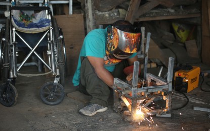 <p><strong>EMPLOYED.</strong> A worker forges steel frames for school chairs at the Bigay Buhay Multipurpose Cooperative compound in Caloocan City on May 23, 2023. The number of unemployed Filipinos went down to 2.33 million in June this year from 2.99 million in the same month last year, data from the Philippine Statistics Authority showed on Wednesday (Aug. 9, 2023). <em>(PNA photo by Joan Bondoc)</em></p>