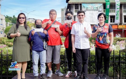 <p><strong>CASH INCENTIVES.</strong> Mayor John Dalipe (2nd right) leads the awarding of cash incentives to Zamboangueño medal haulers in Southeast Asian Games and International Weightlifting Federation World Youth Champions in Zamboanga City on Monday (May 22, 2023). The cash incentive is under a city ordinance that encourages Zamboangueño athletes to excel in sports.<em> (Photo from John Dalipe's Facebook Page)</em></p>
