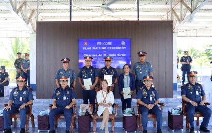 <p><strong>RECOGNITION.</strong> Brig. Gen. Pablo Labra II (seated, 2nd from right), director of the Police Regional Office in the Caraga Region, leads the handing of awards to five police personnel for exemplary performance in Butuan City on Monday (May 22, 2023). Two of the awardees were responsible for the arrest of a top New People’s Army leader in the region last month.<em> (Photo courtesy of PRO-13)</em></p>