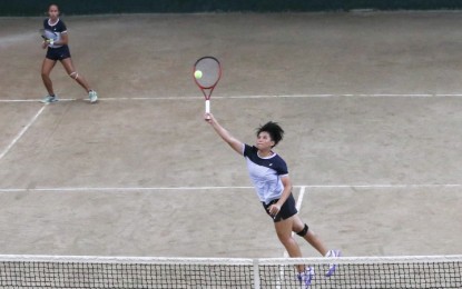 <p><strong>TOP PAIR</strong>. National player Shaira Hope Rivera returns a forehand as Alyssa Mae Bornia looks on during their doubles match in the 2023 Metro Manila Open by Philippine Columbian Association (PCA) tennis tournament at the PCA shell courts in Paco, Manila on Tuesday (May 23, 2023). Rivera and Bornia beat Nichole Dela Rita and Princess Debbie Gom-os, 5-7, 6-1, 10-7, to reach the quarterfinal round. <em>(PNA photo by Yancy Lim)</em></p>