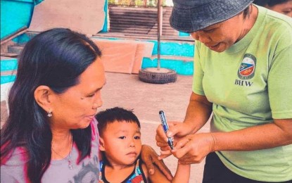 <p><strong>VILLAGE HEALTH WORKER.</strong> A Barangay Health Worker (BHW) marks the finger of a boy who availed of the supplemental immunization activity on May 18, 2023. BHW party-list Rep. Angelica Natasha Co on Friday (Dec. 29, 2023) urged the local health boards to nullify the termination of barangay health workers who were dismissed without due process after the Oct. 30 barangay and Sangguniang Kabataan elections.<em> (PNA photo courtesy of Antique IPHO)</em></p>