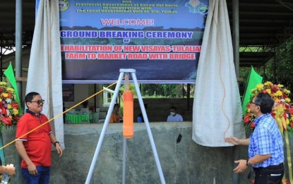 <p><strong>ROAD CONNECTOR.</strong> Department of Agriculture–Philippine Rural Development Project (DA-PRDP) 11 program director Abel James Monteagudo (right) and Davao del Norte Governor Edwin Jubahib unveil the project marker of the farm-to-market road (FMR) on Wednesday (May 24, 2023). The 7.9-kilometer rehabilitation of the New Visayas-Tulalian farm-to-market road will benefit four barangays in Sto. Tomas, Davao del Norte. <em>(Photo courtesy of DA-PRDP 11)</em></p>