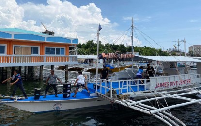 <p><strong>RELIEF PACKS</strong>. Members of the Lapu-Lapu City preparedness and response team unload food and non-food relief items to be prepositioned on Olango Island in anticipation of Typhoon Betty (Mawar). The Lapu-Lapu City government activated its response team comprising personnel from the Lapu-Lapu City Police Office, Philippine Coast Guard, and Lapu-Lapu City Rescue. <em>(Photo courtesy of Lapu-Lapu City PIO)</em></p>