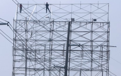 <div class="caption">
<p><strong>READY FOR 'BETTY'.</strong> Workers fold a giant tarpaulin along North Luzon Expressway in Marilao, Bulacan on Friday (May 26, 2023) in preparation for Super Typhoon Mawar. The tropical cyclone that will be named Betty once inside the Philippine Area of Responsibility by Friday night or early Saturday may weaken into a typhoon but is expected to still bring rains and strong winds. <em>(PNA photo by Joey O. Razon)</em></p>
</div>