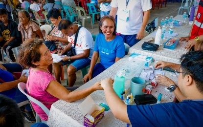 <p><strong>BARANGAY CARAVAN</strong>. Residents of Barangay Sta. Maria in Alaminos City, Pangasinan are all smiles during a medical check-up as part of the Alaminos Barangay Caravan launched on Friday (May 26, 2023). The caravan aims to bring frontline government services to the residents, especially those in far-flung villages. <em>(Photo courtesy of Alaminos LGU)</em></p>