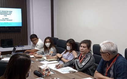 <p><strong>CAPABILITY CHECK</strong>. Amor Banuelos-Calayan (second from right), head of the Batangas Provincial Disaster Risk Reduction and Management Office (PDRRMO), presides over a meeting in this undated photo. Calayan ordered an assessment of the local government units' ability to respond to the effects of the 6.3 magnitude quake that jolted Batangas at 10:19 a.m. on Thursday (June 15, 2023). <em>(Photo courtesy of Batangas PDRRMO)</em></p>