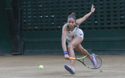 <p><strong>FINALIST.</strong> Second seed Alexa Joy Milliam returns a backhand during her semifinals match against Jessele Marie Ante in the women's singles of the first Metro Manila Open tennis tournament at the Philippine Columbian Association (PCA) indoor shell court in Paco, Manila on May 26, 2023. Milliam won, 7-5, 6-4. <em>(PNA photo by Yancy Lim)</em></p>