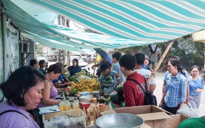 <p><strong>EXTRA INCOME</strong>. Some members of agrarian reform beneficiaries organizations (ARBOs) in Masbate promoting their products in an agricultural fair as part of the 'Agraryo Merkado' project of the Department of Agrarian Reform (DAR) in this undated photo. The initiative has earned PHP627,116 in just 10 days of selling since it started on March 23, 2023, giving additional income to the local farmers.<em>(Photo courtesy of Geri Buensalida/DAR-Bicol)</em></p>