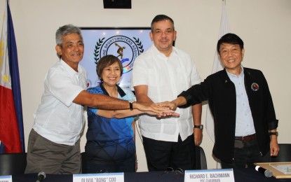 <p><strong>UNITY FOR ATHLETES.</strong> Philippine Sports Commission (PSC) commissioners (from left) Fritz Gaston and Bong Coo, chairman Richard Bachmann, and commissioner Edward Hayco do a unity gesture during the Philippine Sportswriters Association (PSA) Forum at the PSC Press Conference Room, Rizal Memorial Sports Complex in Manila on Tuesday (May 30, 2023). The PSC officials have promised to go beyond just providing the funds for the national team ahead of the Asian Games. <em>(PNA photo by Jess M. Escaros Jr.)</em></p>