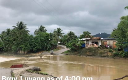 <p><strong>IMPASSABLE</strong>. A spillway in Barangay Luyang, Mabinay town in Negros Oriental overflows on Tuesday afternoon (May 30, 2023), after river waters swelled. At least five spillways in Negros Oriental were rendered impassable due to heavy rains associated with Typhoon Betty and the southwest monsoon. <em>(Photo courtesy of the Mabinay MDRRMO)</em></p>