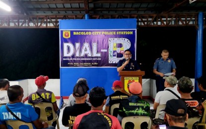 <p><strong>POLICE HOTLINE</strong>. Col. Noel Aliño, acting director of the Bacolod City Police Office, speaks before the chiefs of barangay tanod during the launching of the “Dial-B” police emergency hotline at the BCPO headquarters on Tuesday (May 30, 2023). The initiative provides mobile phones to the tanod leaders in all the city’s 61 barangays, allowing them to directly contact Aliño whenever they need police assistance. <em>(Photo courtesy of Bacolod City Police Office)</em></p>
