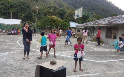 <p><strong>BOOSTING INTERNET</strong>. Bucarot residents receive food packs from Adams local government officials visiting them in this undated photo. The Department of Information and Communications Technology will soon install a communication tower to boost internet connectivity in the area. <em>(Contributed photo)</em></p>