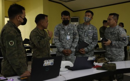 <p><strong>JOINT EXERCISES</strong>. Phillipine Army (PA) and Philippine Air Force (PAF) planners lay out plans for the upcoming interoperability exercise in a conference held at the PA headquarters in Fort Bonifacio, Taguig City on Wednesday (May 31, 2023). Army spokesperson Col. Xerxes Trinidad said this is to array and integrate PA and PAF capabilities for more effective joint operations. <em>(Photo courtesy of PA) </em></p>