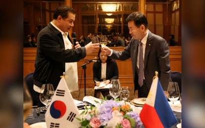 <p><strong>CLOSER ASEAN-KOREA TIES</strong>. Speaker Ferdinand Martin G. Romualdez offers a toast to his counterpart Speaker of the National Assembly of South Korea Kim Jin-pyo during their dinner meeting hosted by the latter at Lotte Hotel in Jeju Island on Thursday (June 1, 2023). Romualdez attended the Association of Southeast Asian Nations (ASEAN)-Korea Leaders Forum held at the Jeju International Convention Center where he called on ASEAN and South Korea leaders to work closer together for peace, stability and prosperity in the region.<em> (Photo courtesy of Office of Speaker Romualdez)</em></p>