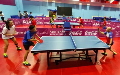 <p><strong>HOPEFUL</strong>. Members of the Philippines team train at the Table Tennis Hall inside the Morodok Techo Sports Complex in Phnom Penh, Cambodia on June 1, 2023. The Filipino paddlers are hoping to win more medals in the ASEAN Para Games taking place in Phnom Penh on June 5-9.<em> (PNA photo by Jean Malanum)</em></p>