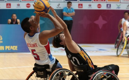 <p><strong>GOOD START</strong>. John Rey Escalante from the Philippines (left) tries to score against an Indonesian defender during the elimination round of the 12th ASEAN Para Games men's 3x3 wheelchair basketball competition at Morodok Techo National Stadium in Phnom Penh, Cambodia on Friday (June 2, 2023). The Filipinos opened their campaign with an 11-5 win. <em>(Pool photo)</em></p>