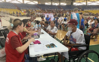 <p><strong>GOVERNMENT AID. </strong>At least 1,500 individuals from Naga City receive cash assistance from the Department of Social Welfare and Development on Saturday (June 3, 2023). Senator Christopher Go also gave grocery items, sports equipment, shoes, bicycles and mobile phones. <em>(PNA photo by Connie Calipay) </em></p>