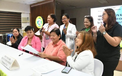 <p><strong>PROTECTION. </strong>Dagupan City Mayor Belen Fernandez (seated, 3rd from left) and representatives of Region 1 Medical Center sign a  memorandum of agreement for improved delivery of services for women and children who are victims of violence on May 31, 2023. The hospital shall also recommend measures to enhance access to social and legal services. <em>(Courtesy of Mayor Belen Fernandez)</em></p>
<p> </p>