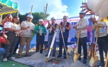 <p><strong>SUPER HEALTH CENTER.</strong> Senator Christopher Lawrence Go (3rd right) leads the embedding of the capsule during the groundbreaking ceremony of the Super Health Center in Digos City, Davao del Sur province on Monday (June 5, 2023). Once completed, the PHP11.5-million project will provide comprehensive basic health services to the people of the province. <em>(PNA photo by Robinson Niñal Jr.)</em></p>