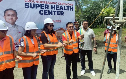 <p><strong>SUPER HEALTH CENTER.</strong> Senator Christopher Lawrence Go, (3rd from right), together with Governor Maria Angelica Rosedell Amante (2nd from left) and Mayor Karen Rosales (3rd from left) lead the groundbreaking ceremony for the establishment of a super health center in Barangay Mat-i, Las Nieves town, Agusan del Norte province on Tuesday (June 6, 2023). The center will bring comprehensive health services to the remote villages in the town, particularly the tribal communities.<em> (PNA photo by Alexander Lopez)</em></p>