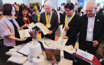 <p><strong>HABLON</strong>. Trade Secretary Alfredo E. Pascual (3rd from left) takes a look at some of the hablon products from Iloilo displayed at the exhibit that was held alongside the launch of “Weave Philippines” at the Park Inn by Radisson in Iloilo City on Thursday (June 8, 2023). Pascual, in his message, challenged the regional DTI office to go beyond the production of specialty garments. <em>(PNA photo by PGLena)</em></p>