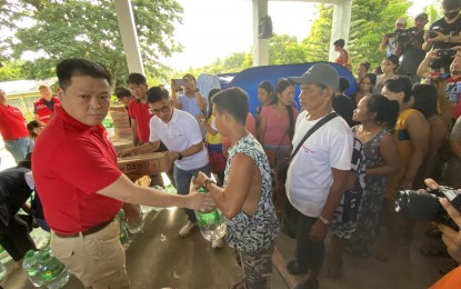 <p><strong>RELIEF OPERATION</strong>. Department of Social Welfare and Development Secretary Rex Gatchalian (left, wearing red) visits Anislag Evacuation Center in Daraga, Albay on Saturday (June 10, 2023). Gatchalian distributed family food packs to evacuees of Barangay Mi-isi, which is located within the 6-km permanent danger zone of restive Mayon Volcano. (<em>PNA photo by Connie Calipay)</em></p>