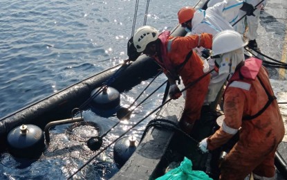 <p><strong>MASSIVE JOB.</strong> The Philippine Coast Guard (PCG) conducts oil spill response efforts in Oriental Mindoro in this April 2023 file photo, two months after oil tanker MT Princess Empress sank off Naujan town. Cleanup operations are likely to be completed by June 19, PCG spokesperson Rear Admiral Armand Balilo said during the Saturday News Forum in Quezon City on June 10, 2023. <em>(Photo courtesy of PCG)</em></p>