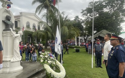 <p><strong>HONOR TO THE NATIONAL HERO.</strong> Ilocos Norte Governor Matthew Joseph Manotoc, along with Col. Julius Suriben, director of the Ilocos Norte Police Provincial Office, offers white flowers at the monument of Dr. Jose Rizal on June 12, 2023. Government officials, uniformed personnel, employees and representatives of private groups came together to celebrate the country's 125th Independence Day with simple rites.<em> (Photo by Leilanie G. Adriano)</em></p>