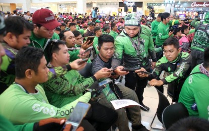 <p><strong>ASENSO RIDERS.</strong> Hundreds of delivery riders flock to a mall in Davao City on Wednesday (June 14, 2023) for the launching of Pag-IBIG Fund’s 'Asenso Rider Raffle Promo'. The event drew transport network vehicle service riders and partner drivers of app-based logistics companies. <em>(PNA photo by Robinson Niñal Jr.)</em></p>