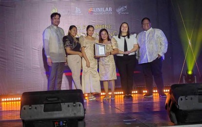 <p><strong>GOOD GOVERNANCE.</strong> Irish Manlapaz, who heads the Antique Provincial Youth Development Office (fourth from left), receives the Most Outstanding Local Youth Development Offices (LYDO) in the Philippines award during the 4th Philippine Sangguniang Kabataan Awards at the Iloilo Convention Center in Iloilo City on June 12, 2023. Manlapaz said in an interview Thursday (June 15, 2023) that the Antique PYDO received the award because of good governance. (<em>PNA photo courtesy of PYDO Antique)</em></p>