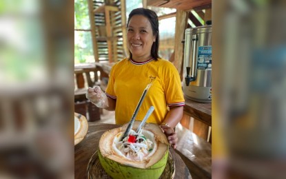<p><strong>WOMAN INNOVATOR</strong>. Marivic Bawalan-Aguirre shows her best-selling special buko halo-halo with fresh locally produced ingredients. This woman innovator is set to represent Apayao province in the upcoming Department of Science and Technology National Innovation Challenge in Metro Manila from June 23 to 24, 2023. <em>(PNA photo by Leilanie Adriano)</em></p>