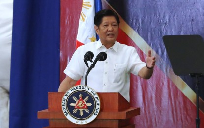 <p><strong>STAYING AS DA CHIEF</strong>. President Ferdinand R. Marcos Jr. delivers a speech during a ceremonial turnover of urea fertilizers donated by China at the National Food Authority warehouse in Malanday, Valenzuela City on Friday (June 16, 2023). He said he would give up his concurrent position as the head of the Department of Agriculture, once he has addressed the pressing issues hounding the agriculture sector. <em>(PNA photo by Joey Razon)</em></p>