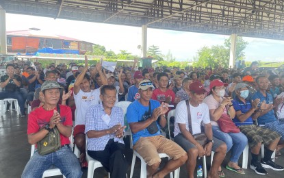 <p><strong>ASSISTANCE.</strong> Local fishermen receive PHP3,000 each during a turnover ceremony held at the Laoag central terminal on Friday. The recipients are fishermen whose source of livelihood will be affected once the dredging operation of the Padsan River goes into full swing (<em>PNA photo by Leilanie Adriano</em>)</p>