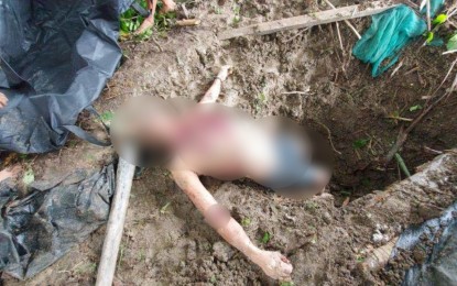 <p><strong>UNEARTHED.</strong> The remains of the 63-year-old carpenter who was murdered and buried at a pit near his home in Barangay Poblacion 2, Midsayap, North Cotabato are found on Thursday morning (June 15, 2023). Police arrested four suspects on the afternoon of the same day that included the victim’s nephew who is the primary suspect. <em><strong>(Photo courtesy of Midsayap MPS)</strong></em></p>