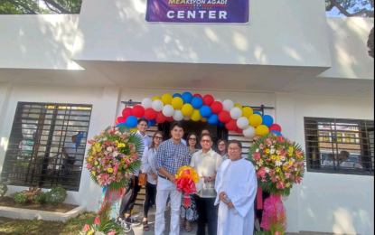 <p><strong>BAYANIJUAN FESTIVAL</strong>. Mayor Vincent Arjay Mea (second from right) and Vice Mayor Dick Umali on Monday (June 19, 2023) open the Display Center in Tiaong town, Quezon province which houses locally made products including aromatic candles and keychains. A host of events is lined up to feature the town's products and cuisine during the weeklong BayanNiJuan Festival. <em>(Photo by Belinda Otordoz)</em></p>