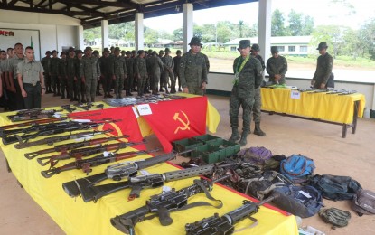 <p><strong>SEIZED RIFLES</strong>. Soldiers stand in formation in front of rifles and war materiel seized from New People's Army rebels in this undated photo. The Visayas Command on Monday (June 19, 2023) said it commended 31 soldiers from the Joint Task Force "Storm" assigned in Eastern Visayas region for their peace efforts that led to the reduction of manpower and armed capabilities of the NPA. <em>(Photo courtesy of Viscom PIO)</em></p>